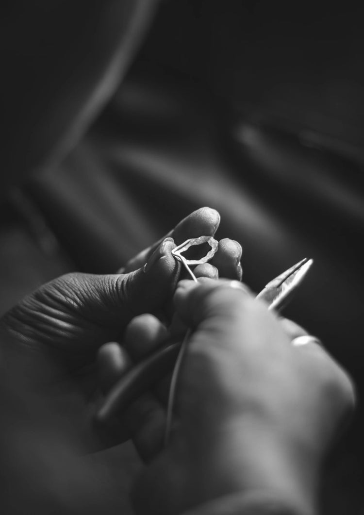 A karigar at work on the drop