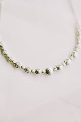 Lunar Cycle Beaten Silver Arc Necklace