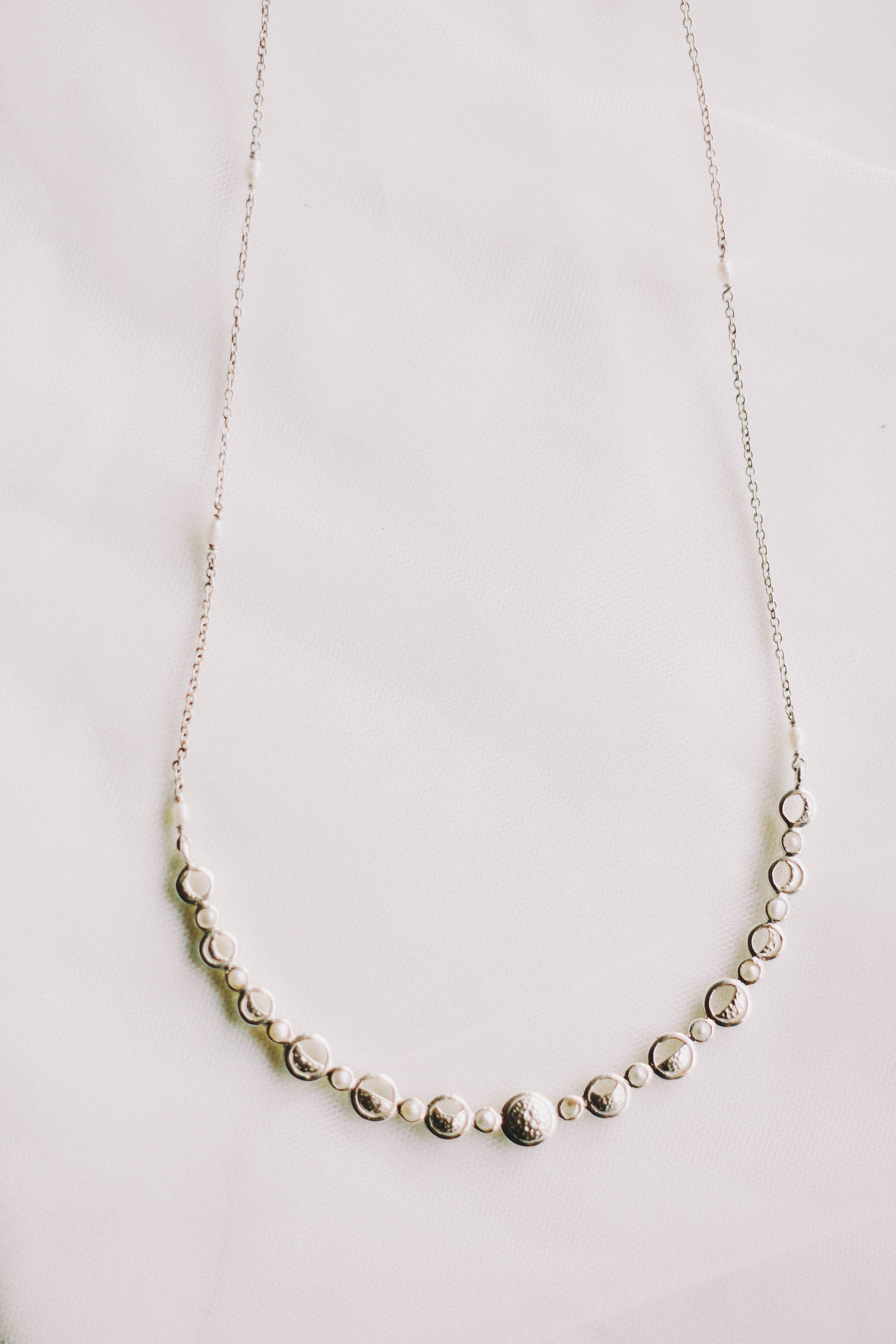 Lunar Cycle Beaten Silver Arc Necklace